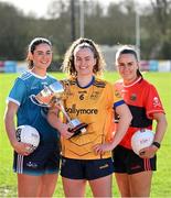29 February 2024; Emma Duggan of DCU, centre, with Rachel Brennan of TUD, left, and Kelly Ann Hogan of UCC and the O'Connor Cup during the LGFA Higher Education Football Championships Captains Day at MTU Cork. Photo by Brendan Moran/Sportsfile