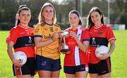 29 February 2024; Captain's, from left, Christina O'Sullivan of UCC, Caoimhe Madden of DCU, Ellen Maguire of MTU Cork and Mairead Bennett of UCC with the Lynch Cup during the LGFA Higher Education Football Championships Captains Day at MTU Cork. Photo by Brendan Moran/Sportsfile