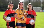 29 February 2024; Captain's, from left, Christina O'Sullivan of UCC, Caoimhe Madden of DCU, and Mairead Bennett of UCC with the Lynch Cup during the LGFA Higher Education Football Championships Captains Day at MTU Cork. Photo by Brendan Moran/Sportsfile