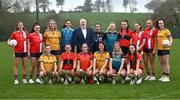 29 February 2024; Chairperson of the LGFA HEC Daniel Caldwell with players from the competing colleges, back row, from left, Eimear Boland of MTU Cork, Caitlin O'Mahony of MTU Cork, Caoimhe Madden of DCU, Rachel Brennan of TUD, Anna O'Dea of SETU Waterford, Elaine Keogh of Maynooth University, Christina O'Sullivan of UCC, Ellen Maguire of MTU Cork, Katie O'Driscoll of MTU Cork and Emma Duggan of DCU and front row, from left, Hannah McHugh of DCU, Kelly Ann Hogan of UCC, Sophie Hennessy of MICL, Louise Pearl of DCU, Becky Doran of Maynooth and Mairead Bennett of UCC and the O'Connor, Lynch, Moynihan, Lagan, HEC, Donaghy and Giles Cups during the LGFA Higher Education Football Championships Captains Day at MTU Cork. Photo by Brendan Moran/Sportsfile