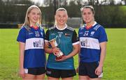 29 February 2024; Elaine Keogh of Maynooth University, centre, with Caoimhe Evans of MTU Kerry, left, Danielle O'Leary of MTU Kerry and the Giles Cup during the LGFA Higher Education Football Championships Captains Day at MTU Cork. Photo by Brendan Moran/Sportsfile