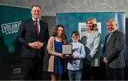 29 February 2024; Chiara and Stephen Moylan receive their award on behalf of their father, Martin Moylan of Dunbrody Archers, Wexford, from Minister of State for Sport and Physical Education Thomas Byrne TD, left, Federation of Irish Sport chair Clare McGrath, second from right, and Louth Sports Partnership and Louth County Council head of sport, Federation of Irish Sport board member and member of the Awards Judging Panel Graham Russell, during the Federation of Irish Sport Volunteers in Sport Awards at The Crowne Plaza Hotel in Blanchardstown, Dublin. Photo by Seb Daly/Sportsfile