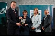 29 February 2024; Nuala Lawlor of Shoot 'n Stars Special Olympics, Westmeath, second from left, receives her award from Minister of State for Sport and Physical Education Thomas Byrne TD, left, Federation of Irish Sport chair Clare McGrath, second from right, and Louth Sports Partnership and Louth County Council head of sport, Federation of Irish Sport board member and member of the Awards Judging Panel Graham Russell, during the Federation of Irish Sport Volunteers in Sport Awards at The Crowne Plaza Hotel in Blanchardstown, Dublin Photo by Seb Daly/Sportsfile