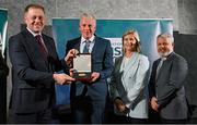 29 February 2024; Paddy Doyle of Moyne Athletic Club, Tipperary, second from left, receives his award from Minister of State for Sport and Physical Education Thomas Byrne TD, left, Federation of Irish Sport chair Clare McGrath, second from right, and Louth Sports Partnership and Louth County Council head of sport, Federation of Irish Sport board member and member of the Awards Judging Panel Graham Russell, during the Federation of Irish Sport Volunteers in Sport Awards at The Crowne Plaza Hotel in Blanchardstown, Dublin. Photo by Seb Daly/Sportsfile