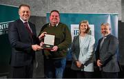 29 February 2024; Philip Gordan of Lough Ree Angling Hub, Roscommon, second from left, receives his award from Minister of State for Sport and Physical Education Thomas Byrne TD, left, Federation of Irish Sport chair Clare McGrath, second from right, and Louth Sports Partnership and Louth County Council head of sport, Federation of Irish Sport board member and member of the Awards Judging Panel Graham Russell, during the Federation of Irish Sport Volunteers in Sport Awards at The Crowne Plaza Hotel in Blanchardstown, Dublin. Photo by Seb Daly/Sportsfile