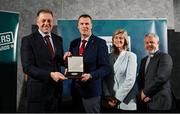 29 February 2024; Phelim Halligan of Claremorris Ultimate Kickboxing Club, Mayo, second from left, receives his award from Minister of State for Sport and Physical Education Thomas Byrne TD, left, Federation of Irish Sport chair Clare McGrath, second from right, and Louth Sports Partnership and Louth County Council head of sport, Federation of Irish Sport board member and member of the Awards Judging Panel Graham Russell, during the Federation of Irish Sport Volunteers in Sport Awards at The Crowne Plaza Hotel in Blanchardstown, Dublin. Photo by Seb Daly/Sportsfile