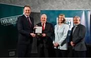 29 February 2024; Jackie  Byrne of Mountrath St. Fintan's GAA, Laois, second from left, receives his award from Minister of State for Sport and Physical Education Thomas Byrne TD, left, Federation of Irish Sport chair Clare McGrath, second from right, and Louth Sports Partnership and Louth County Council head of sport, Federation of Irish Sport board member and member of the Awards Judging Panel Graham Russell, during the Federation of Irish Sport Volunteers in Sport Awards at The Crowne Plaza Hotel in Blanchardstown, Dublin. Photo by Seb Daly/Sportsfile