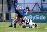 29 February 2024; Joshua Divilly of St Michael’s College is tackled by Bruce Ryan of Belvedere College during the Bank of Ireland Leinster Schools Junior Cup quarter-final match between St Michael's College and Belvedere College at Energia Park in Dublin. Photo by Daire Brennan/Sportsfile
