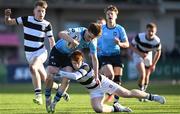 29 February 2024; James McMahon of St Michael’s College is tackled by Mícheál Cooper of Belvedere College during the Bank of Ireland Leinster Schools Junior Cup quarter-final match between St Michael's College and Belvedere College at Energia Park in Dublin. Photo by Daire Brennan/Sportsfile