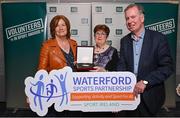 29 February 2024; Award winner Sally Kavanagh of Waterford Hockey Club, Waterford, centre, with Rosarie Kealy of Waterford Sports Partnership, Terry Hayes, chair of Waterford Sports Partnership, during the Federation of Irish Sport Volunteers in Sport Awards at The Crowne Plaza Hotel in Blanchardstown, Dublin. Photo by Seb Daly/Sportsfile