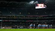 24 February 2024; The teams stand for a minute's applause in memory of the late Billie Grogan, wife of Croke Park stadium announcer Jerry Grogan, before the Allianz Football League Division 1 match between Dublin and Kerry at Croke Park in Dublin. Photo by Brendan Moran/Sportsfile