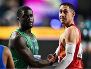 1 March 2024; Israel Olatunde of Ireland, left, and Sergio López of Spain after their heat of the Men's 60m during day one of the World Indoor Athletics Championships 2024 at Emirates Arena in Glasgow, Scotland. Photo by Sam Barnes/Sportsfile