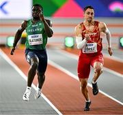 1 March 2024; Israel Olatunde of Ireland, left, and Sergio López of Spain during their heat of the Men's 60m during day one of the World Indoor Athletics Championships 2024 at Emirates Arena in Glasgow, Scotland. Photo by Sam Barnes/Sportsfile