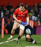 1 March 2024; Seán O'Brien of Munster is tackled by Simone Gesi of Zebre Parma during the United Rugby Championship match between Munster and Zebre Parma at Virgin Media Park in Cork. Photo by Brendan Moran/Sportsfile