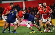 1 March 2024; Mike Haley of Munster is tackled by Leonard Krumov, right, and Muhamed Hasa of Zebre Parma during the United Rugby Championship match between Munster and Zebre Parma at Virgin Media Park in Cork. Photo by Brendan Moran/Sportsfile
