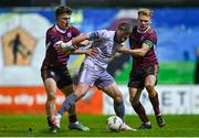 1 March 2024; Darragh Power of Waterford in action against Edward McCarthy, left, and Conor McCormack of Galway United during the SSE Airtricity Men's Premier Division match between Galway United and Waterford at Eamonn Deacy Park in Galway. Photo by Tyler Miller/Sportsfile