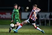 1 March 2024; Kian Leavy of St Patrick's Athletic in action against Daniel Kelly of Derry City during the SSE Airtricity Men's Premier Division match between Derry City and St Patrick's Athletic at The Ryan McBride Brandywell Stadium in Derry. Photo by Ben McShane/Sportsfile