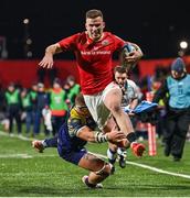 1 March 2024; Shane Daly of Munster beats the tackle from Giovanni Licata of Zebre Parma on his way to scoring his side's seventh try during the United Rugby Championship match between Munster and Zebre Parma at Virgin Media Park in Cork. Photo by Brendan Moran/Sportsfile