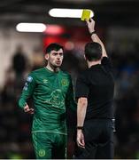 1 March 2024; Cian Kavanagh of St Patrick's Athletic recieves a yellow card from referee Robert Harvey during the SSE Airtricity Men's Premier Division match between Derry City and St Patrick's Athletic at The Ryan McBride Brandywell Stadium in Derry. Photo by Ben McShane/Sportsfile