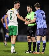1 March 2024; Referee Chris Sheehan speaks with Charlie Lyons of Cork City, left, and Ciaran Behan of UCD during the SSE Airtricity Men's First Division match between Cork City and UCD at Turner's Cross in Cork. Photo by Michael P Ryan/Sportsfile
