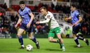 1 March 2024; Jack Doherty of Cork City in action against Harry Curtis, left, and Eanna Clancy of UCD during the SSE Airtricity Men's First Division match between Cork City and UCD at Turner's Cross in Cork. Photo by Michael P Ryan/Sportsfile