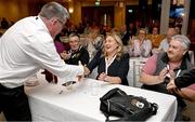2 March 2024; Leinster LGFA President Trina Murray is congratulated by defeated presidential candidate Seamus O'Hanlon after being confirmed as Uachtarán Tofa of the LGFA during the LGFA Annual Congress at The Falls Hotel in Ennistymon, Clare. Photo by Brendan Moran/Sportsfile