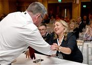 2 March 2024; Leinster LGFA President Trina Murray is congratulated by defeated presidential candidate Seamus O'Hanlon after being confirmed as Uachtarán Tofa of the LGFA during the LGFA Annual Congress at The Falls Hotel in Ennistymon, Clare. Photo by Brendan Moran/Sportsfile