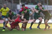 2 March 2024; Cathal Forde of Connacht is tackled by Shaun Evans, left, and Sam Lousi of Scarlets during the United Rugby Championship match between Connacht and Scarlets at Dexcom Stadium in Galway. Photo by Stephen Marken/Sportsfile