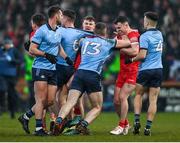 2 March 2024; Derry players Cormac Murphy, left, and Shay Downey tussle with Dublin players Paddy Small, 13, and Eoin Murchan, 4, during the Allianz Football League Division 1 match between Derry and Dublin at Celtic Park in Derry. Photo by David Fitzgerald/Sportsfile