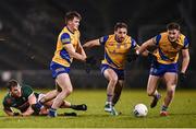 2 March 2024; Roscommon players, from left, Brian Stack, James Fitzpatrick and Dylan Ruane chase the ball as Aidan O'Shea of Mayo looks on during the Allianz Football League Division 1 match between Mayo and Roscommon at Hastings Insurance MacHale Park in Castlebar, Mayo. Photo by Piaras Ó Mídheach/Sportsfile
