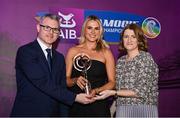 2 March 2024; Lucy Allen of Sarsfields, Cork, centre, is presented with her 2023 Team of the Year award by Uachtarán an Cumann Camógaíochta, Hilda Breslin and Chief Marketing Officer of AIB, Mark Doyle during the AIB Camogie Club Player Awards at Croke Park in Dublin. The awards recognise the top performing players throughout the AIB Camogie Club Championships and celebrate their hard work, commitment, and individual achievements from the 2023 season. Photo by Seb Daly/Sportsfile