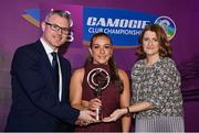 2 March 2024; Ciara Phelan of Dicksboro, Kilkenny, centre, is presented with her 2023 Team of the Year award by Uachtarán an Cumann Camógaíochta, Hilda Breslin and Chief Marketing Officer of AIB, Mark Doyle during the AIB Camogie Club Player Awards at Croke Park in Dublin. The awards recognise the top performing players throughout the AIB Camogie Club Championships and celebrate their hard work, commitment, and individual achievements from the 2023 season. Photo by Seb Daly/Sportsfile