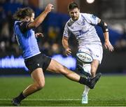 2 March 2024; Ross Byrne of Leinster kicks under pressure from Max Clark of Cardiff during the United Rugby Championship match between Cardiff and Leinster at Cardiff Arms Park in Cardiff, Wales. Photo by Harry Murphy/Sportsfile