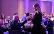 2 March 2024; 2023 AIB Camogie Club Player of the Year Aoife Prendergast of Dicksboro, Kilkenny, is congratulated by Brian Phelan, father of teammate Ciara, during the AIB Camogie Club Player Awards at Croke Park in Dublin. Photo by Seb Daly/Sportsfile