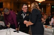 2 March 2024; Leinster LGFA President Trina Murray is congratulated by Gerry Doherty after being confirmed as Uachtarán Tofa of the LGFA during the LGFA Annual Congress at The Falls Hotel in Ennistymon, Clare. Photo by Brendan Moran/Sportsfile