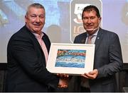 2 March 2024; Clare LGFA chairman Sean Lenihan makes a presentation to Uachtarán Cumann Peil Gael na mBan, Mícheál Naughton during the LGFA Annual Congress at The Falls Hotel in Ennistymon, Clare. Photo by Brendan Moran/Sportsfile