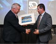 2 March 2024; Clare LGFA chairman Sean Lenihan makes a presentation to Uachtarán Cumann Peil Gael na mBan, Mícheál Naughton during the LGFA Annual Congress at The Falls Hotel in Ennistymon, Clare. Photo by Brendan Moran/Sportsfile