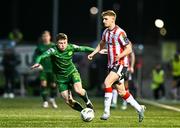 1 March 2024; Ronan Boyce of Derry City and Kian Leavy of St Patrick's Athletic during the SSE Airtricity Men's Premier Division match between Derry City and St Patrick's Athletic at The Ryan McBride Brandywell Stadium in Derry. Photo by Ben McShane/Sportsfile