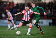 1 March 2024; Ben Doherty of Derry City and Chris Forrester of St Patrick's Athletic during the SSE Airtricity Men's Premier Division match between Derry City and St Patrick's Athletic at The Ryan McBride Brandywell Stadium in Derry. Photo by Ben McShane/Sportsfile