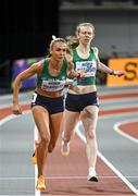 3 March 2024; Sharlene Mawdsley of Ireland, left, takes the baton from team-mate Roisin Harrison whilst competing in the women's 4x400m relay during day three of the World Indoor Athletics Championships 2024 at Emirates Arena in Glasgow, Scotland. Photo by Sam Barnes/Sportsfile