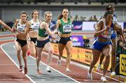 3 March 2024; Roisin Harrison of Ireland, third from left, takes the baton from team-mate Sophie Becker whilst competing in the women's 4x400m relay during day three of the World Indoor Athletics Championships 2024 at Emirates Arena in Glasgow, Scotland. Photo by Sam Barnes/Sportsfile
