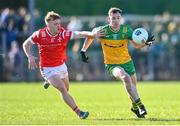 3 March 2024; Ciarán Thompson of Donegal in action against Ciaran Keenan of Louth during the Allianz Football League Division 2 match between Donegal and Louth at Fr Tierney Park in Ballyshannon, Donegal. Photo by David Fitzgerald/Sportsfile