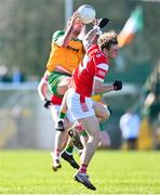 3 March 2024; Daire O'Baoill of Donegal in action against Leonard Grey of Louth during the Allianz Football League Division 2 match between Donegal and Louth at Fr Tierney Park in Ballyshannon, Donegal. Photo by David Fitzgerald/Sportsfile