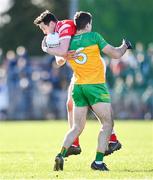3 March 2024; Tommy Durnin of Louth in action against Caolan McGonagle of Donegal during the Allianz Football League Division 2 match between Donegal and Louth at Fr Tierney Park in Ballyshannon, Donegal. Photo by David Fitzgerald/Sportsfile