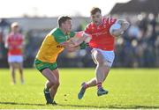 3 March 2024; Ciaran Keenan of Louth in action against Peadar Mogan of Donegal during the Allianz Football League Division 2 match between Donegal and Louth at Fr Tierney Park in Ballyshannon, Donegal. Photo by David Fitzgerald/Sportsfile