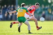 3 March 2024; Ryan Burns of Louth in action against Mark Curran of Donegal during the Allianz Football League Division 2 match between Donegal and Louth at Fr Tierney Park in Ballyshannon, Donegal. Photo by David Fitzgerald/Sportsfile