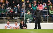 3 March 2024; Tyrone joint-manager Brian Dooher with players Darren McCurry, Darragh Canavan and Conn Kilpatrick on the bench during the Allianz Football League Division 1 match between Kerry and Tyrone at Fitzgerald Stadium in Killarney, Kerry. Photo by Brendan Moran/Sportsfile