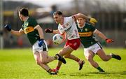 3 March 2024; Darragh Canavan of Tyrone in action against Paul Murphy and Gavin White of Kerry during the Allianz Football League Division 1 match between Kerry and Tyrone at Fitzgerald Stadium in Killarney, Kerry. Photo by Brendan Moran/Sportsfile