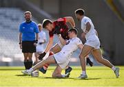 3 March 2024; Ian Maguire of Cork in action against Jack Sargent and Ryan Houlihan, right, of Kildare during the Allianz Football League Division 2 match between Cork v Kildare at SuperValu Páirc Ui Chaoimh in Cork. Photo by Piaras Ó Mídheach/Sportsfile