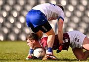 3 March 2024; Seán Mulkerrin of Galway holds possession under pressure from Jack McCarron of Monaghan during the Allianz Football League Division 1 match between Monaghan and Galway at St Tiernach's Park in Clones, Monaghan. Photo by Ben McShane/Sportsfile